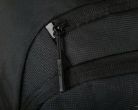 black laptop backpack on white background close up of zipper