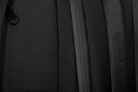 Close-up of a black textured bag with a strap