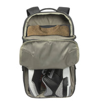 Backpack with a sweater and shoes inside on a white background