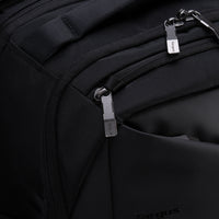 Close-up of a black backpack with zippers and 'Targus' branding.