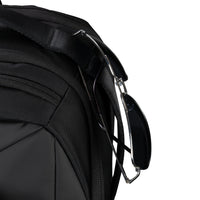 Close-up of a black backpack strap on a white background
