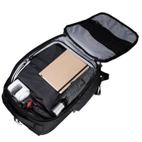 Black backpack with compartments and items on a white background