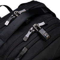 Black backpack with multiple zippers and a padlock on a white background