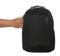 Black backpack held by a hand on a white background