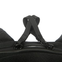 Close-up of a black backpack strap on a white background