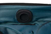 Close-up of a blue bag with a black valve
