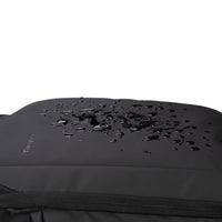 Black laptop sleeve with water droplets demonstrating water resistance on a white background