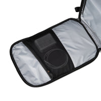 Black backpack open showing inside pocket