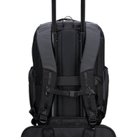 Black backpack with visible trolley straps on a white background