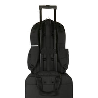 black backpack with trolley strap on suitcase