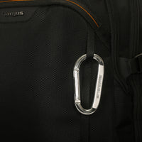 Black backpack with a carabiner on a black background