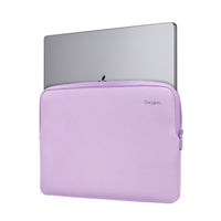 Purple laptop sleeve with a silver laptop inside on a white background