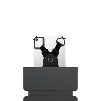 Black phone holder with a smartphone on a white background