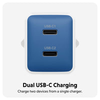 A blue dual USB-C charging adapter with two USB-C ports, shown on a light gray background with text below reading 'Dual USB-C Charging' and 'Charge two devices from a single charger.'.