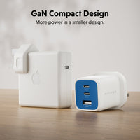 Two compact wall chargers on a wooden surface: a white Apple charger with a black logo and a white Hyper charger with a blue front panel. Text at the top reads 'GaN Compact Design' and 'More power in a smaller design.