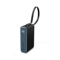 A Hyper portable power bank in dark gray and black, featuring a built-in black wrist strap, a digital LED battery percentage display showing 100%, and a vertical Hyper logo on the front.